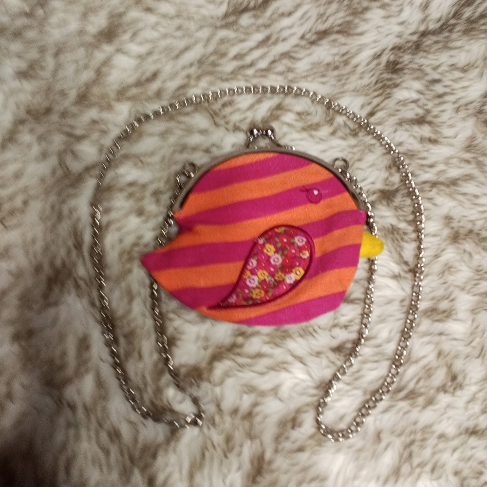 1989 Place cute little coin purse on a chain